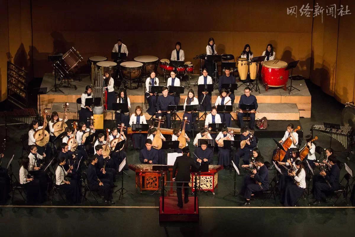 The Chinese orchestra on stage during a concert, seen from above